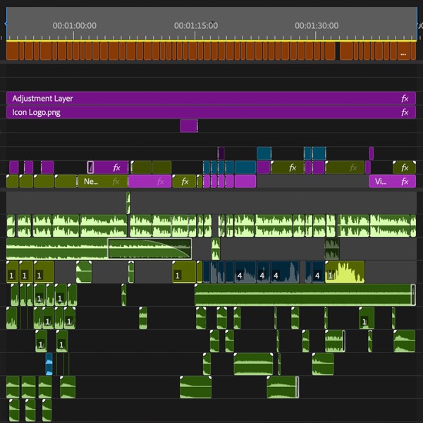 A dense Premiere Pro timeline with dozens of stacked video and audio tracks
