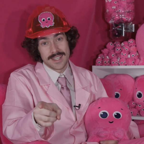 Xander in character on a hot pink Octopus Energy set